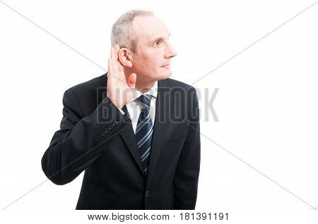 Portrait Of Elegant Senior Making Can't Hear You Gesture