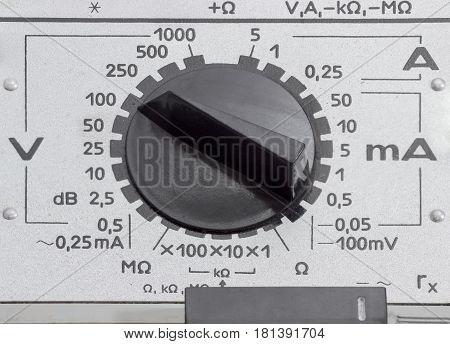 Panel of the analog multimeter older design with two mode switches various designs closeup