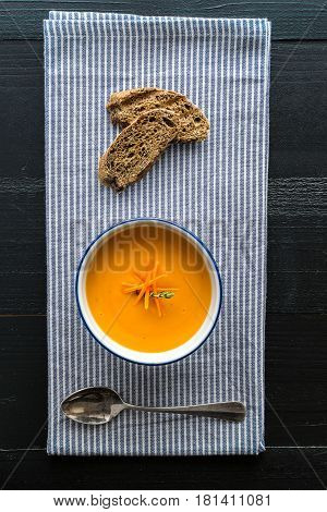 Carrot Soup Served in Bowl with Bread. Homemade Cream Carrot and Potato Pottage.