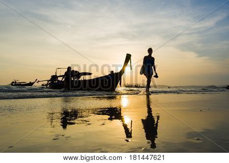 Ao Nang Krabi Thailand - March 03 2017: People on the Ao Nang beach at sunset in Krabi province Thailand