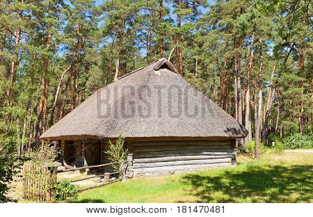 RIGA LATVIA - JUNE 13 2016: Cattle shed (circa 1850s) of Grotkaltini farmstead of Vidzeme ethnic group. Exhibited in Ethnographic Open-Air Museum of Latvia since 1934