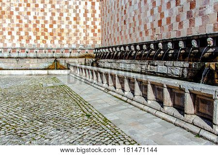 Fountain of the 99 Spouts (Fontana delle 99 cannelle) Historic fountain with 99 jets distribuited along three walls L Aquila Italy