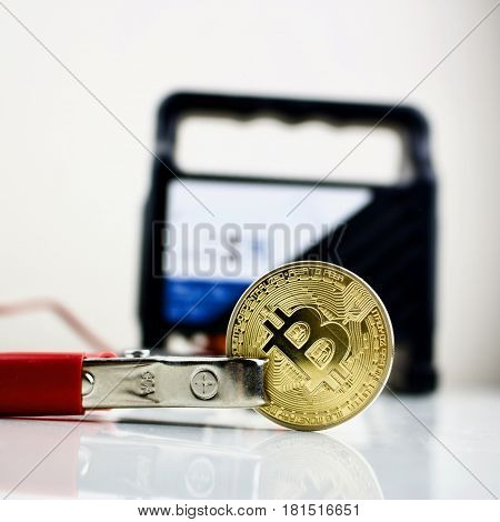 Bitcoin Gold Coin And Car Battery Charger