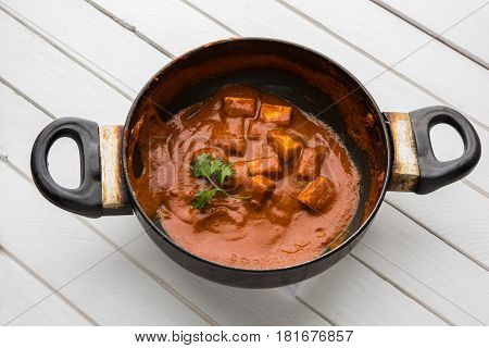 paneer butter masala or cheese cottage curry, popular indian lunch/dinner menu in weddings or parties, selective focus