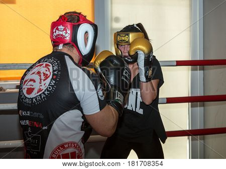CRACOW POLAND - FEBRUARY 12 2016: Agnieszka Niestoj - talented Polish boxer durning boxing training with coach in the gym. Cracow Poland
