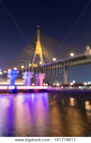 Night blurred bokeh suspension brdige light river front abstract background