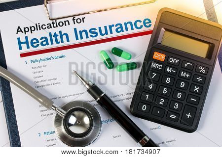 Application Form For Health Insurance, Paperwork, Questionnaire, Pen, Tablet, Calculator And Stethos