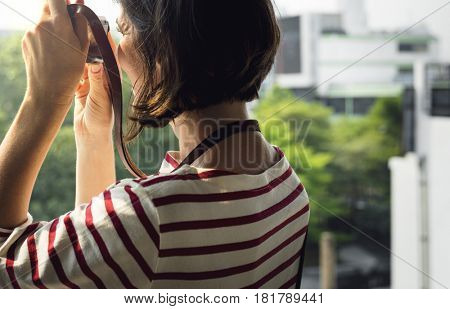 Woman traveler photographer holiday lifestyle trip