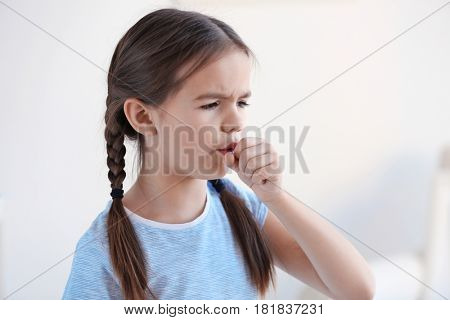 Cute little girl with allergy at home