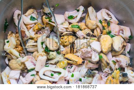 cooked seafood calamari and mussels as a background