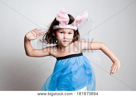 Asian Girl dresses up in bunny ears