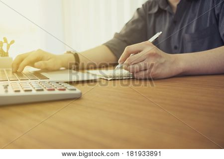 Concept Of Using Electronics. Businessman Works At Office. Computer, Laptop, Tablet, Caculator And O