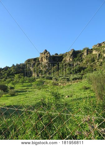 Rockscape against blue sky in Andalusian countryside