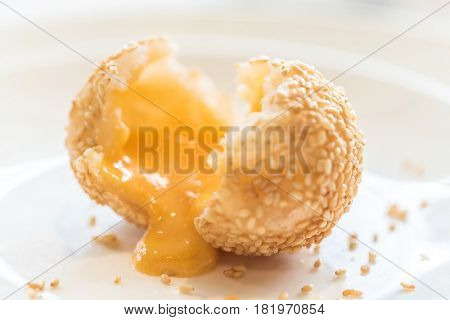 Chinese dim sum Fried sesame balls stuff with custard lava - Chinese groumet cuisine