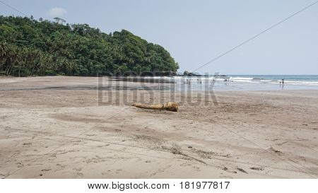 SEVEN WAVE BEACH, SAO TOME - JANUARY 29, 2017: People go swimming on the Seven Wave Beach on January 29, 2017 in Sao Tome and Principe, Africa