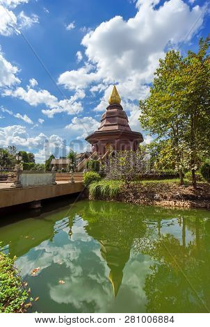 Sam Than Chao Khun Pagoda With Thai Language Post In Wat Pai Lom, Trad Province, Thailand.