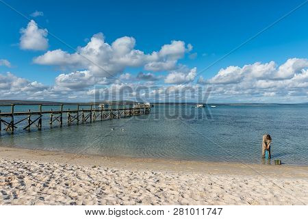 West Coast National Park, South Africa, August 20, 2018: A Person Digging For Prawns At The Jetty At