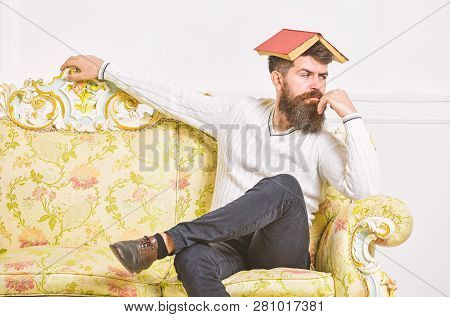 Macho Sits With Open Book On Head, Like Roof. Boring Literature Concept. Guy Bored, Fed Up Of Readin