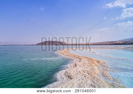 Israel. The Salt Flats Of The Dead Sea. Blue Sky And Mountains In The Background.  The Path From Sal