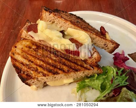 Turkish Tost / Toast Sandwich With Melted Cheese And Suck / Sujuk Served With Salad.