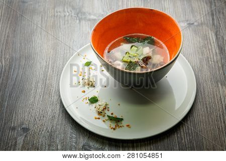 Delicious Noodle Soup With Mushrooms, Meat, And Nettle Leaves