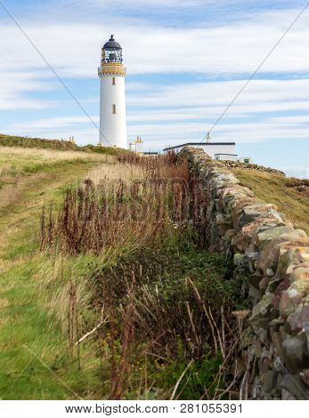 Rock Wall Leading To The Mull Of Galloway Lighthouse In Dumfries And Galloway, Scotland, United King