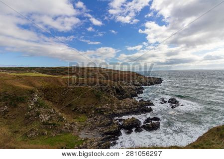 Cliffs Overlooking The Sea Near Portpatrick, Scotland, United Kindom Under A Dramatic Sky