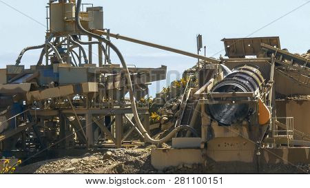 Machinery At An Open-cut Gold Mine In New Zealand Processes Alluvial Gravel For Gold