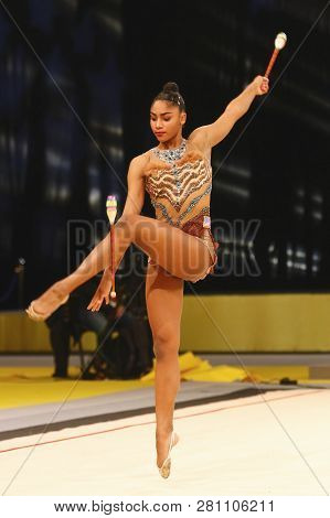 Kyiv, Ukraine - March 18, 2017: Rhythmic Gymnast Nastasya Generalova Of Usa Performs With Clubs Duri