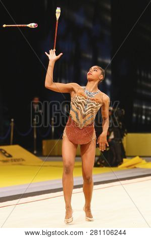 Kyiv, Ukraine - March 18, 2017: Rhythmic Gymnast Nastasya Generalova Of Usa Performs With Clubs Duri