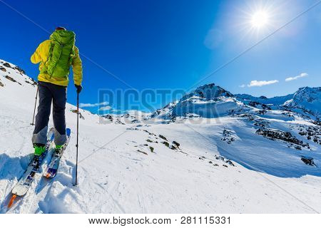 Skitouring with amazing view of swiss famous mountains in beautiful winter powder snow of Alps. 