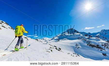 Skitouring with amazing view of swiss famous mountains in beautiful winter powder snow of Alps. 