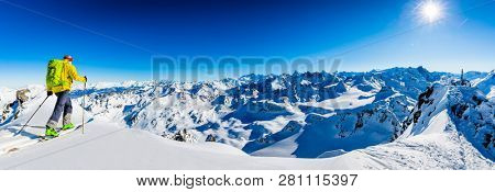 Skitouring with amazing view of swiss famous mountains in beautiful winter powder snow of Alps. 