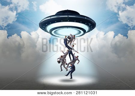 Flying saucer abducting young businessman 