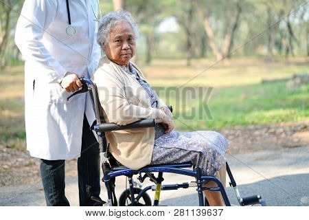 Doctor Help And Care Asian Senior Or Elderly Old Lady Woman Patient Sitting On Wheelchair At Nursing