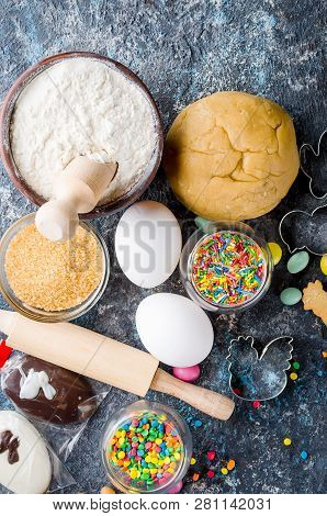 Easter Cooking Background, Dough And Indredients, Cuts For Cookies And Colored Sugar Décor For Bakin