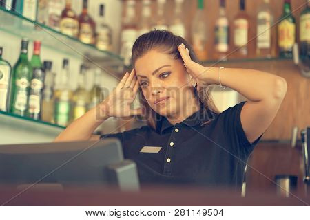 Female Bartender Hotel Bar Made A Mistake In The Bill. A Barmaid Registrating New Order By Cash Regi