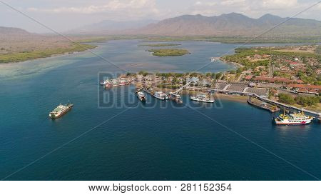 Aerial View Ferry Port Gilimanuk With Ferry Boats, Vehicles. Ferries Transport Vehicles And Passenge