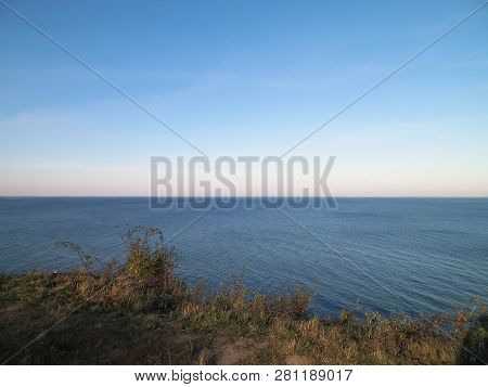 Baltic Sea From Cliff In Mechelinki, Poland. Nature And Travel Concept. Copy Space On Blue Sky.
