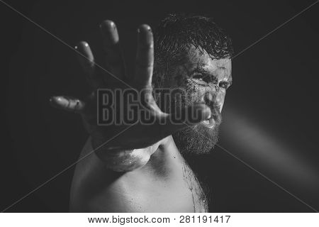 Hipster With Bloody Beard Make Stop Gesture On Black Background. Man With Angry Bearded Face. Wizard