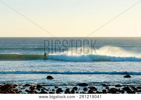 Surfer On The Wave Of The Ocean. Warm Sunny Day. Sport. Relaxation.