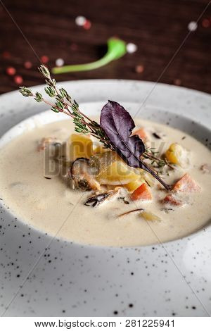 American Cuisine Concept. American Soup Clam Chowder With Chicken Broth And Milk, With Bacon And Mus