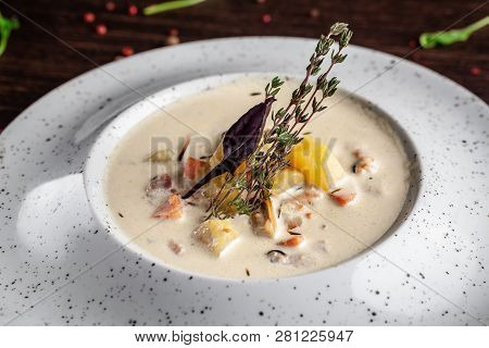 American Cuisine Concept. American Soup Clam Chowder With Chicken Broth And Milk, With Bacon And Mus
