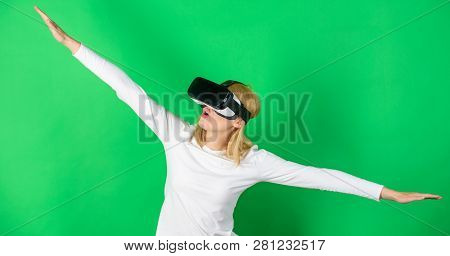 Woman Watching Virtual Reality Vision. Woman Using Virtual Reality Headset. Woman Wearing Virtual Re