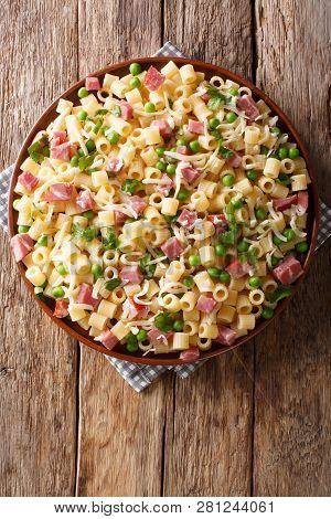 Rustic Style Ditalini Pasta With Green Peas, Ham And Cheese Closeup On A Plate. Vertical Top View