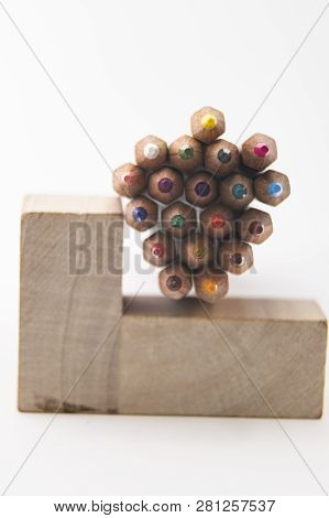 Wooden Colored Pencils On A White Background
