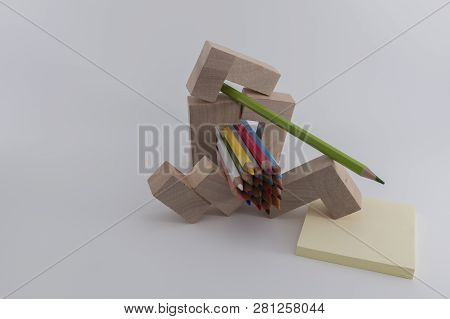 Wooden Colored Pencils On A White Background