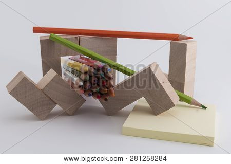 Wooden Colored Pencils On A White Background