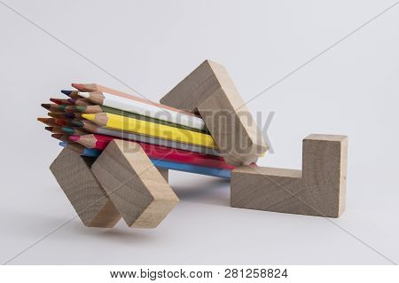 Wooden Colored Pencils On A White Background