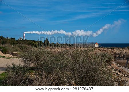 Factory Chimneys With One Long Line Of Smoke